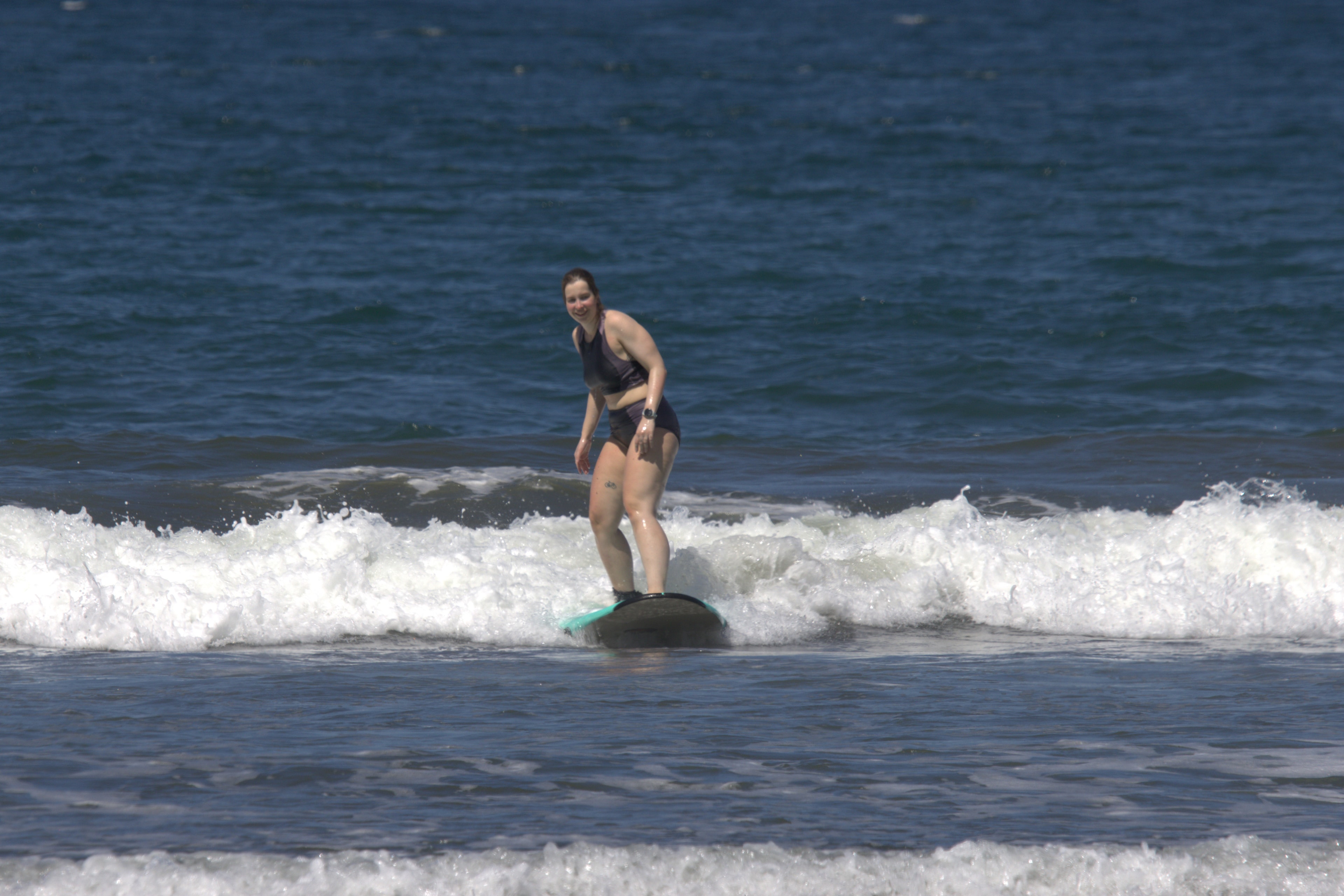 Guest surfing a wave at Tropical Camas surf camp